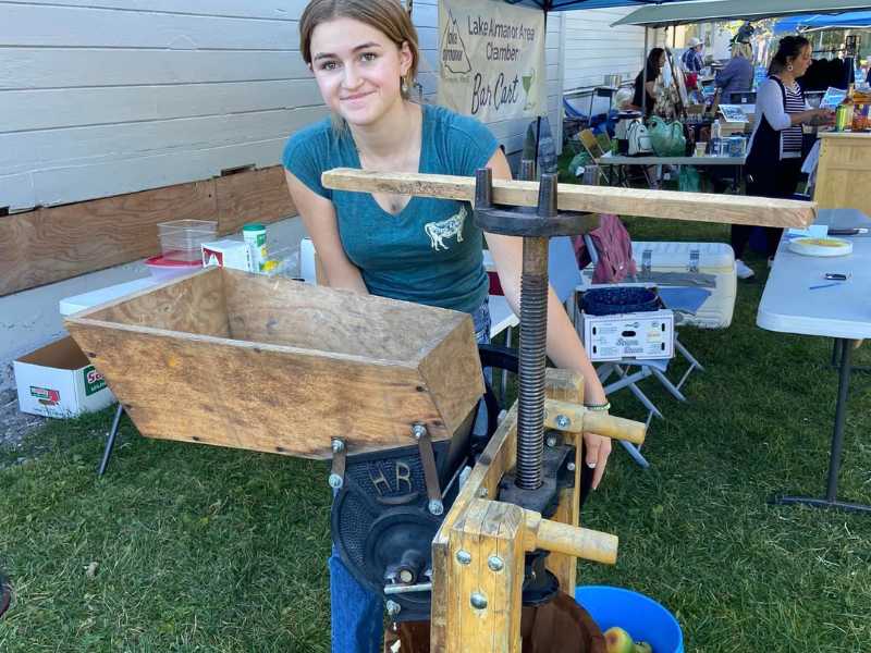 Girl with Press at Lake Almanor Farmer's Market