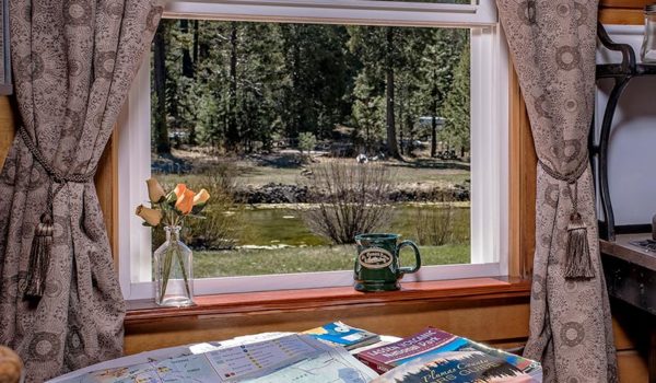 St. Bernard Lodge Near Lassen Volcanic Park. Coffe area with view of pond and magazines
