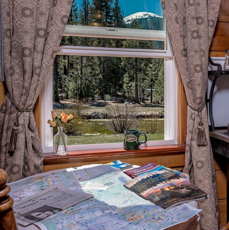 St. Bernard Lodge Near Lassen Volcanic Park. Coffe area with view of pond and magazines
