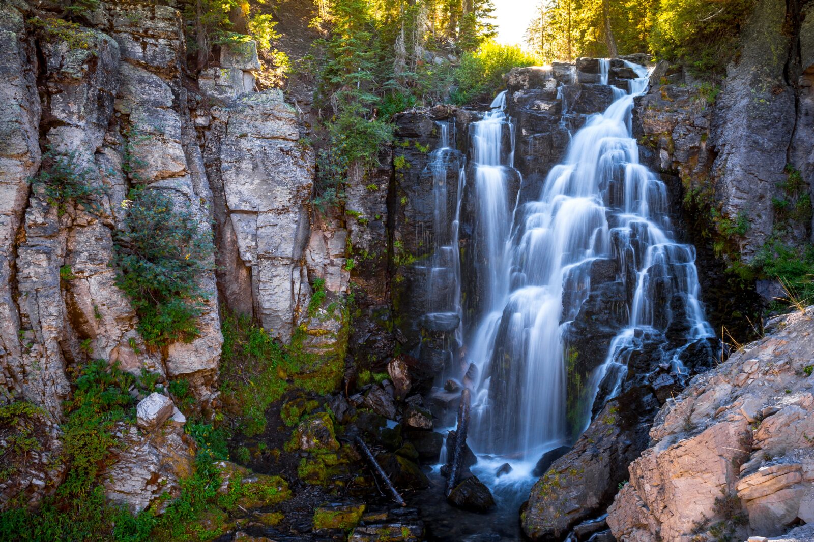 Sunset on Kings Creek Falls, as the water tumbles down the rock face in Lassen National Park.